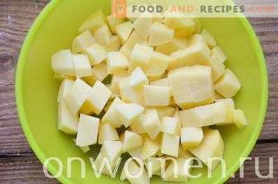 Kip in potten met aardappelen en courgette